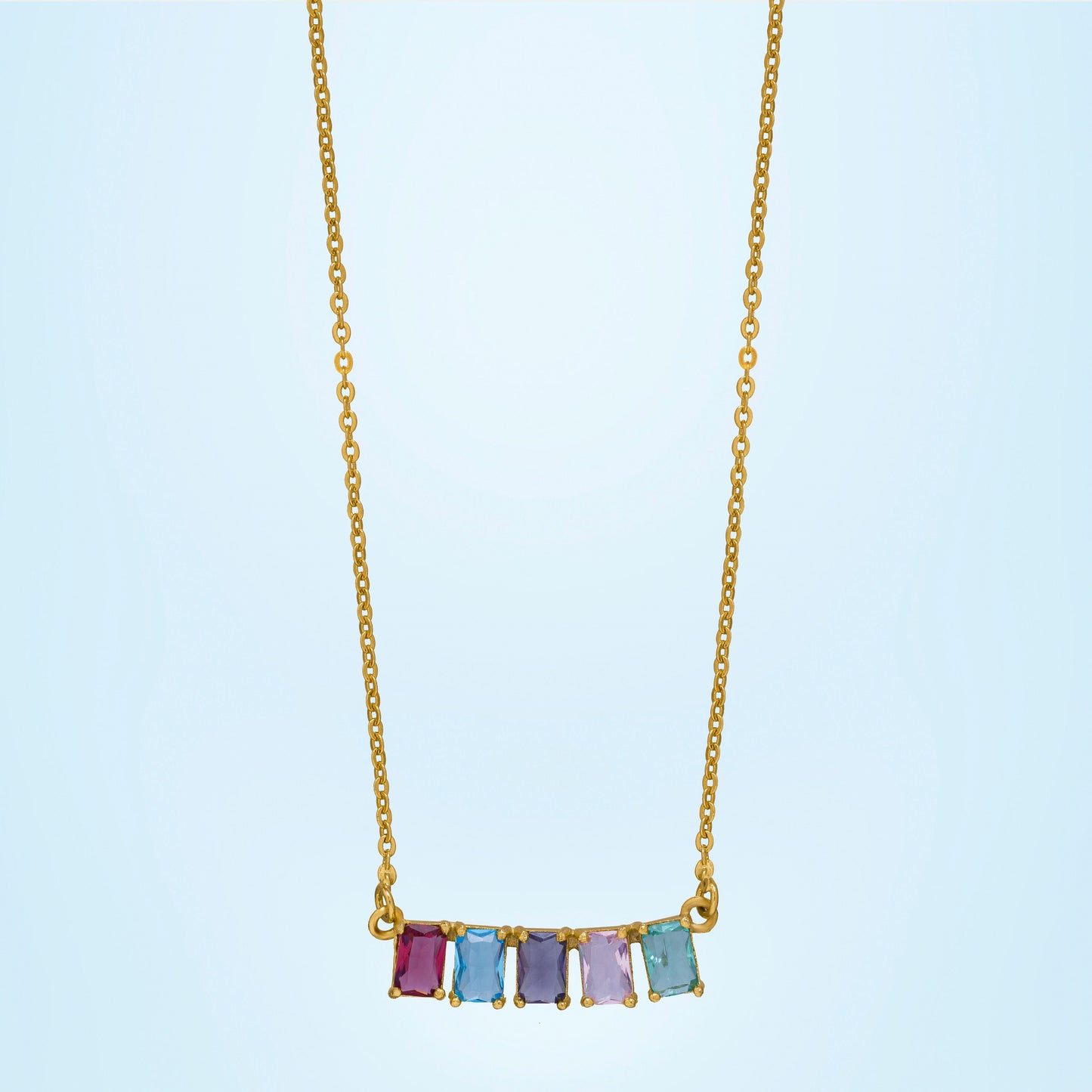 golden necklace with five rainbow stones