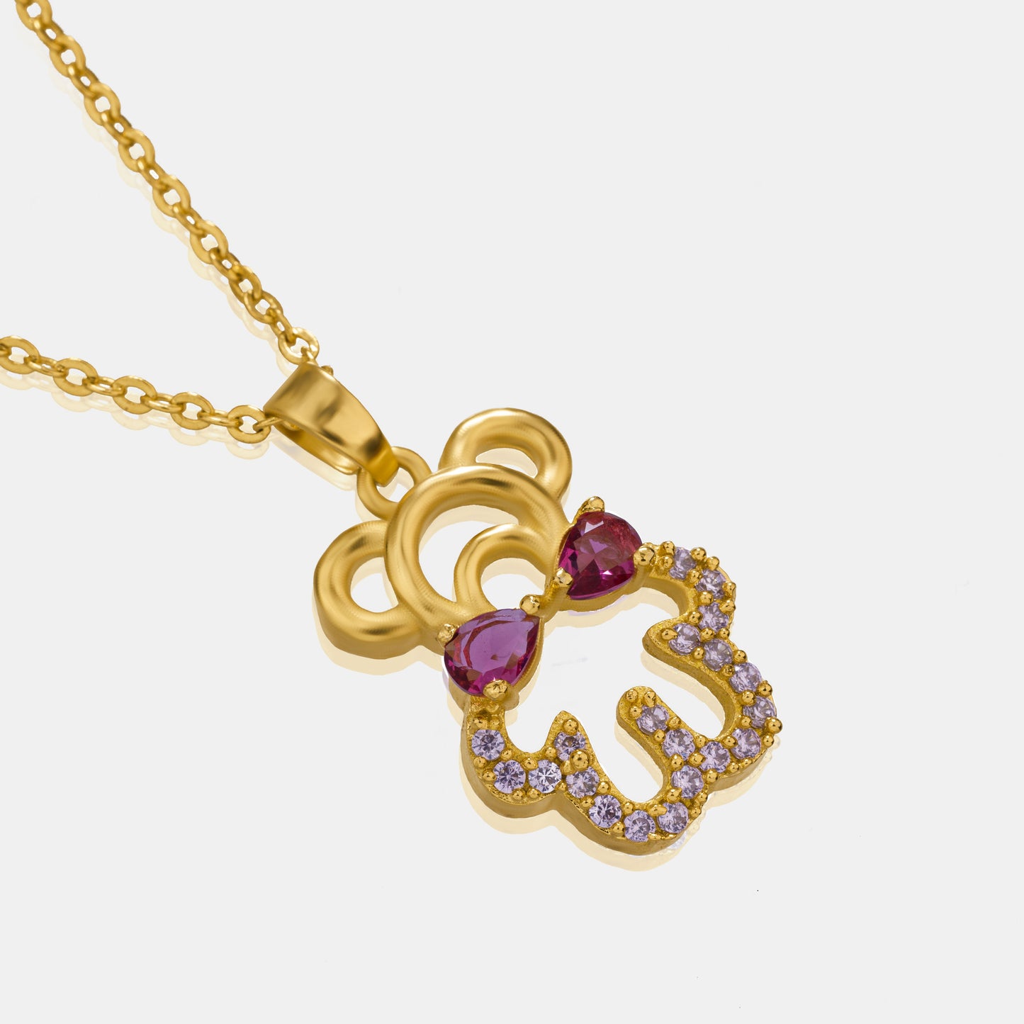 golden necklace with a heart and a diamond