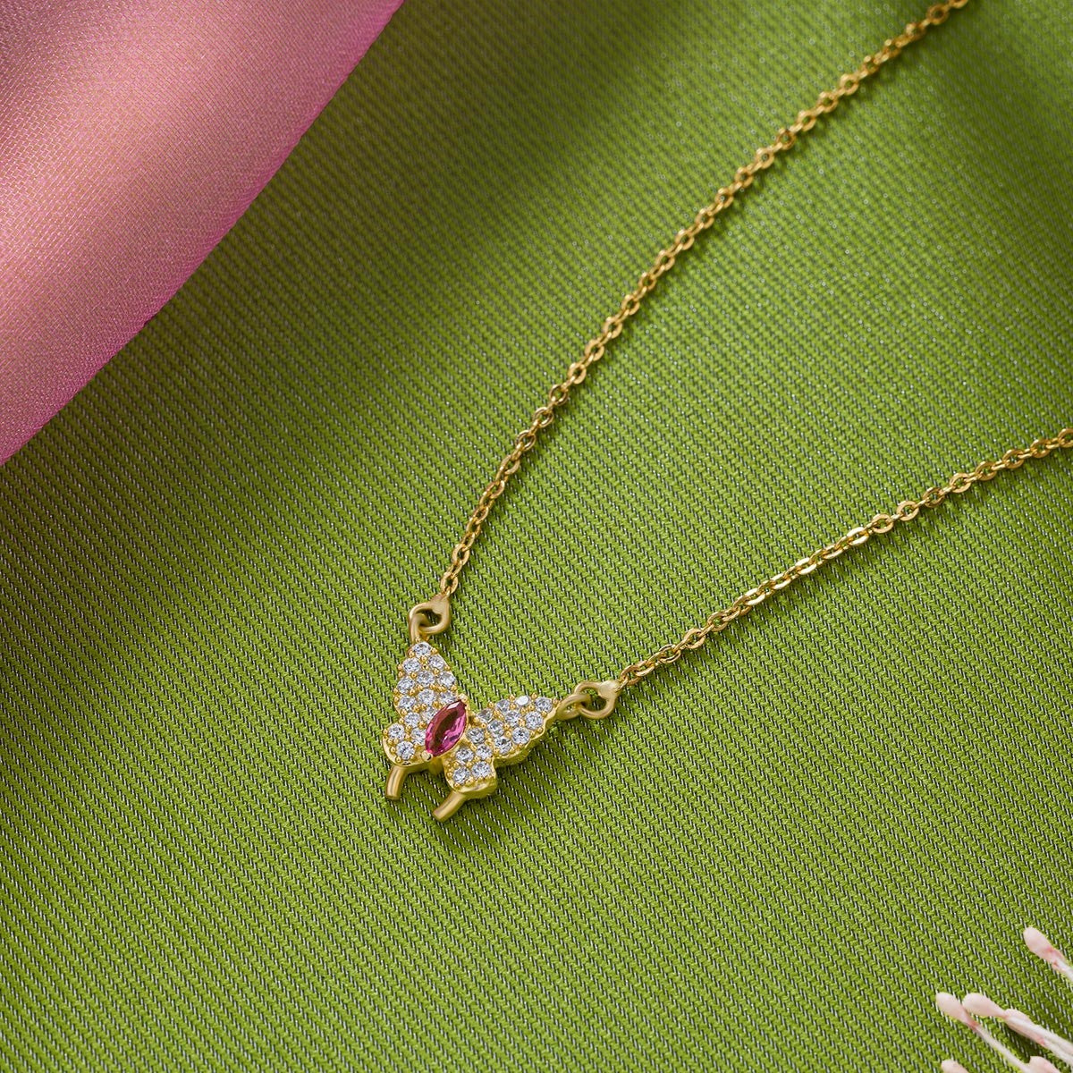 golden necklace with a butterfly pendant