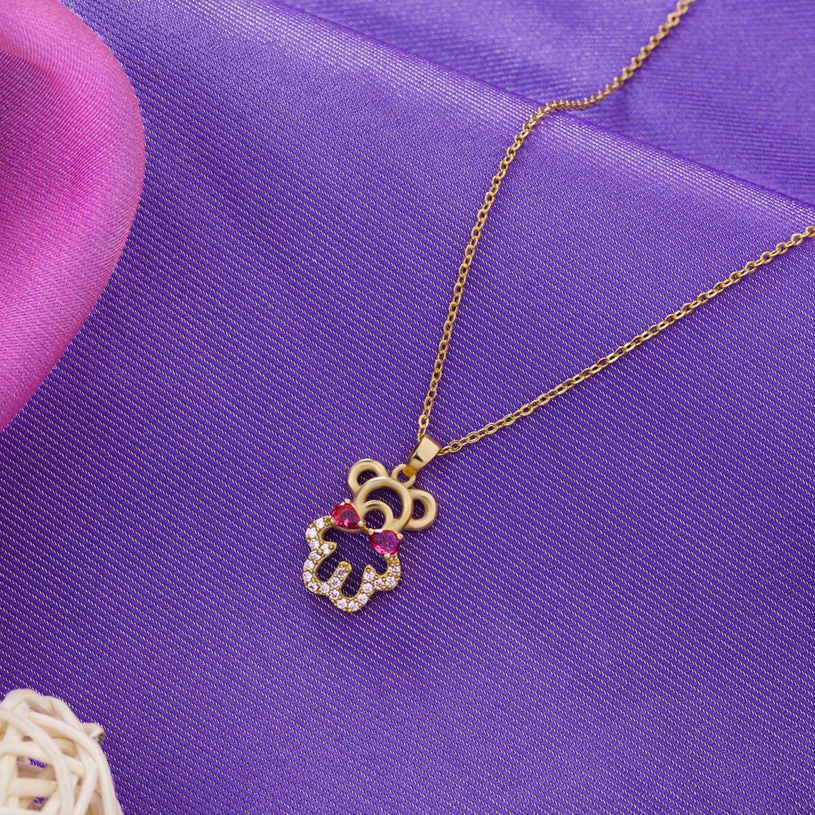 golden necklace with a heart and a diamond