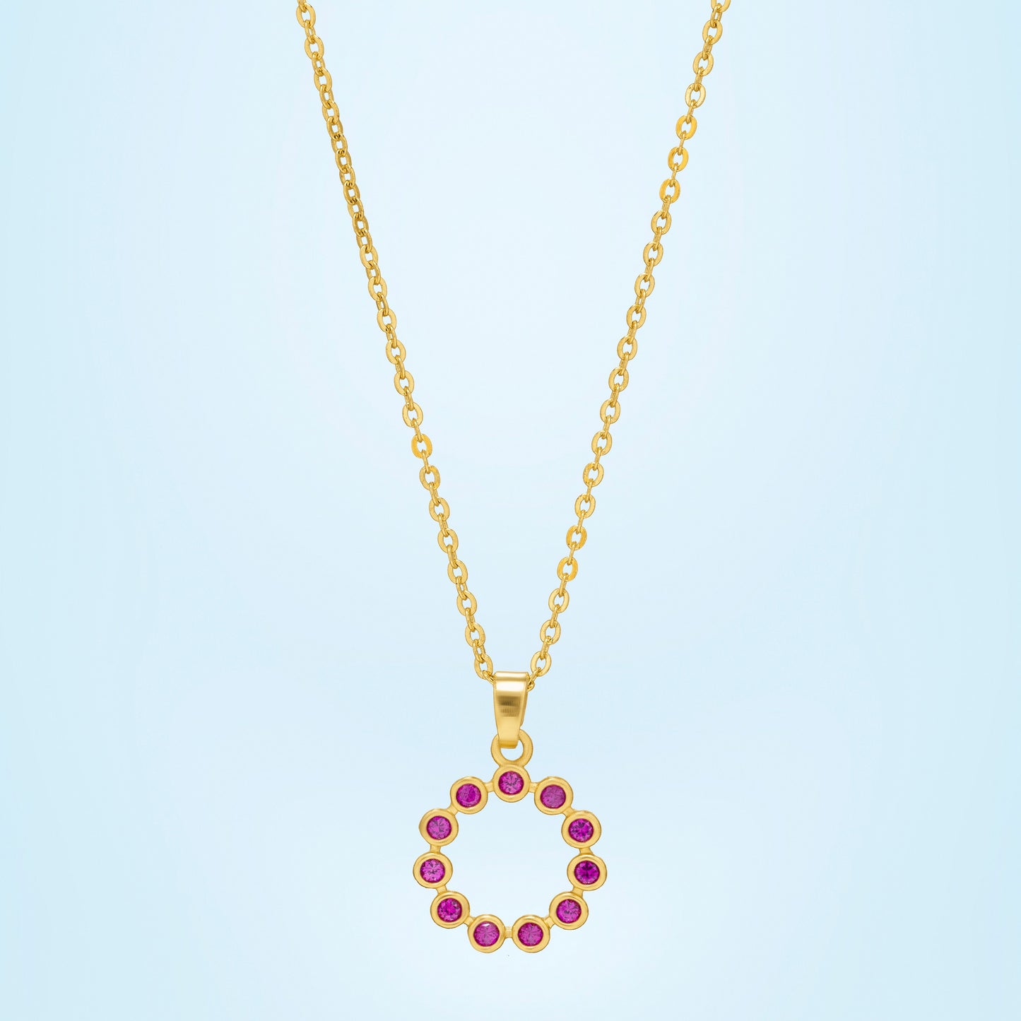 golden necklace with a purple stone pendant