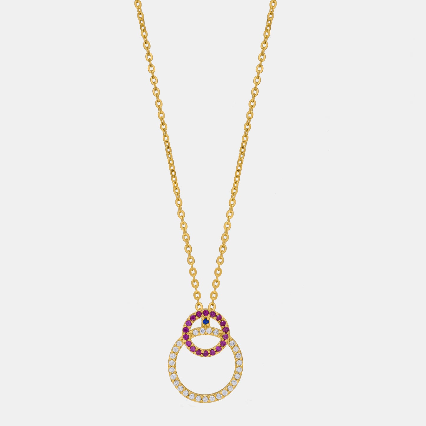 golden necklace with a diamond and ruby stone