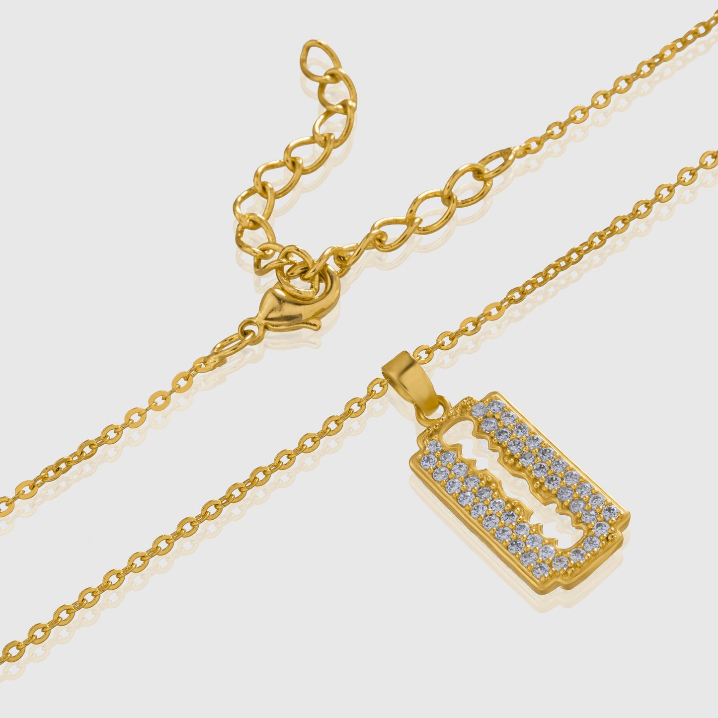 golden necklace with a diamond bar pendant