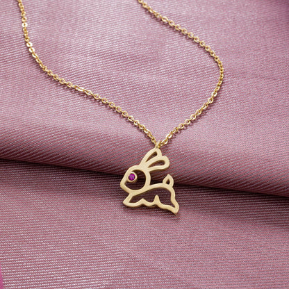 Golden Necklace with a Pink Stone on it