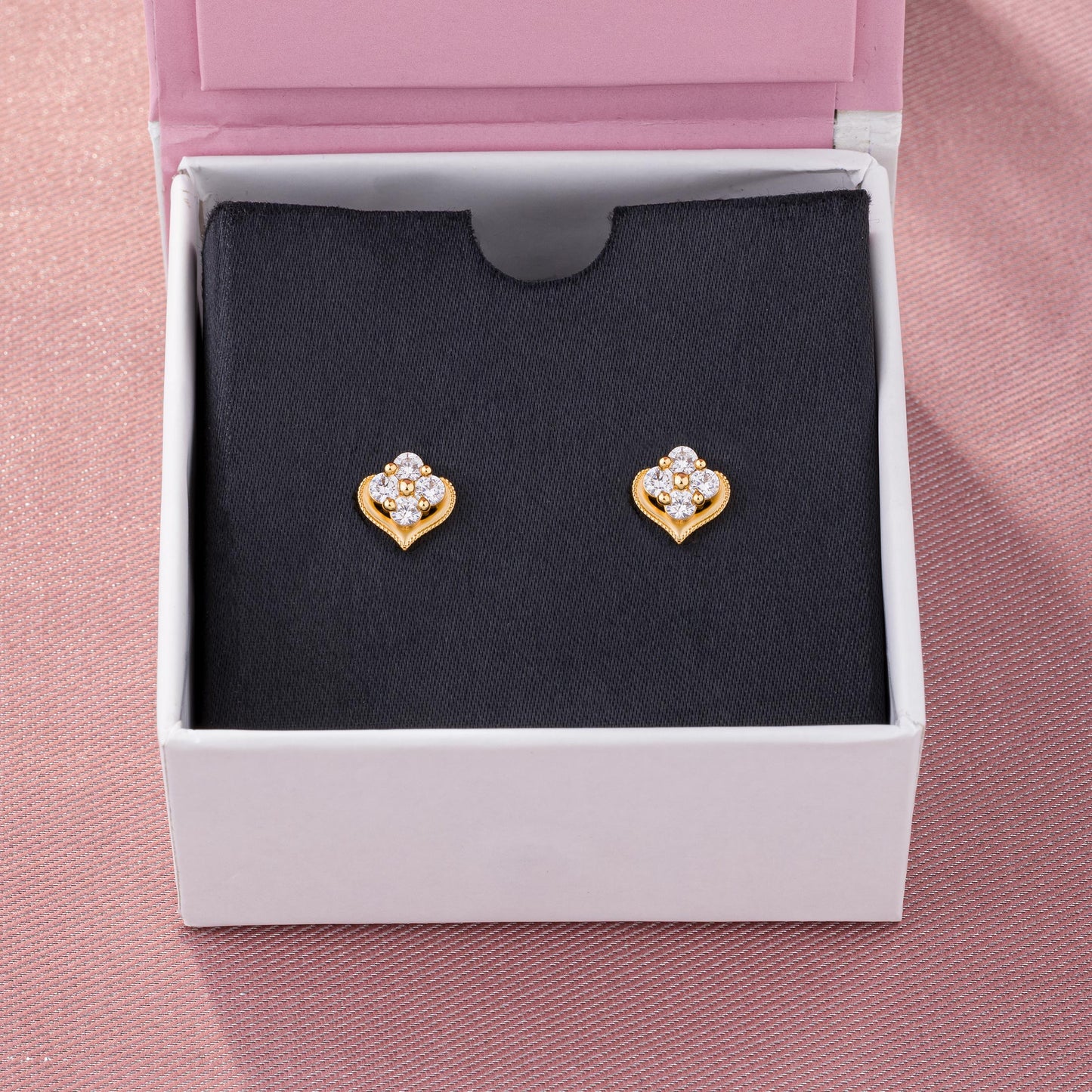 pair of golden earrings with diamonds