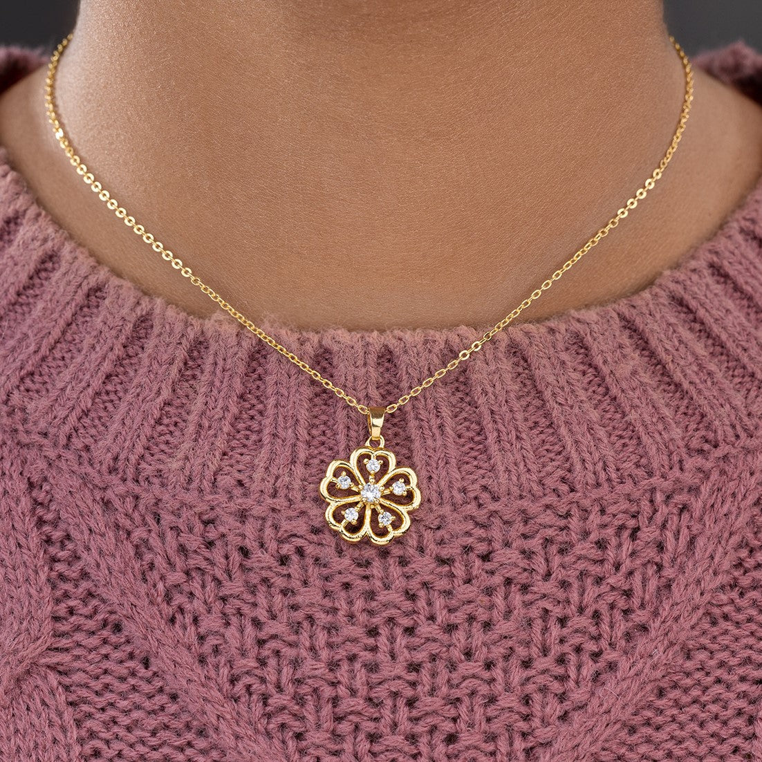 golden necklace with a clover design