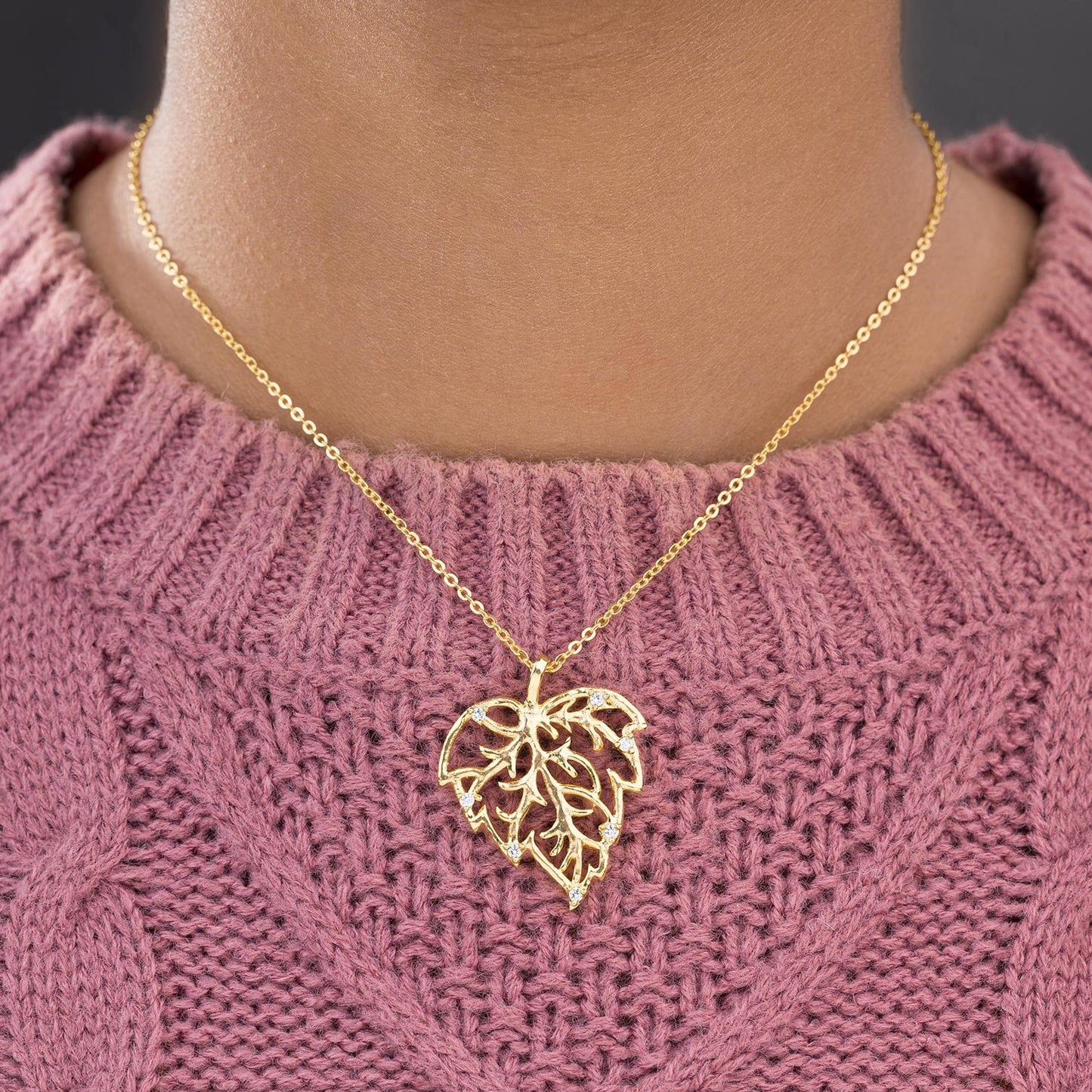 golden necklace with a leaf design on it