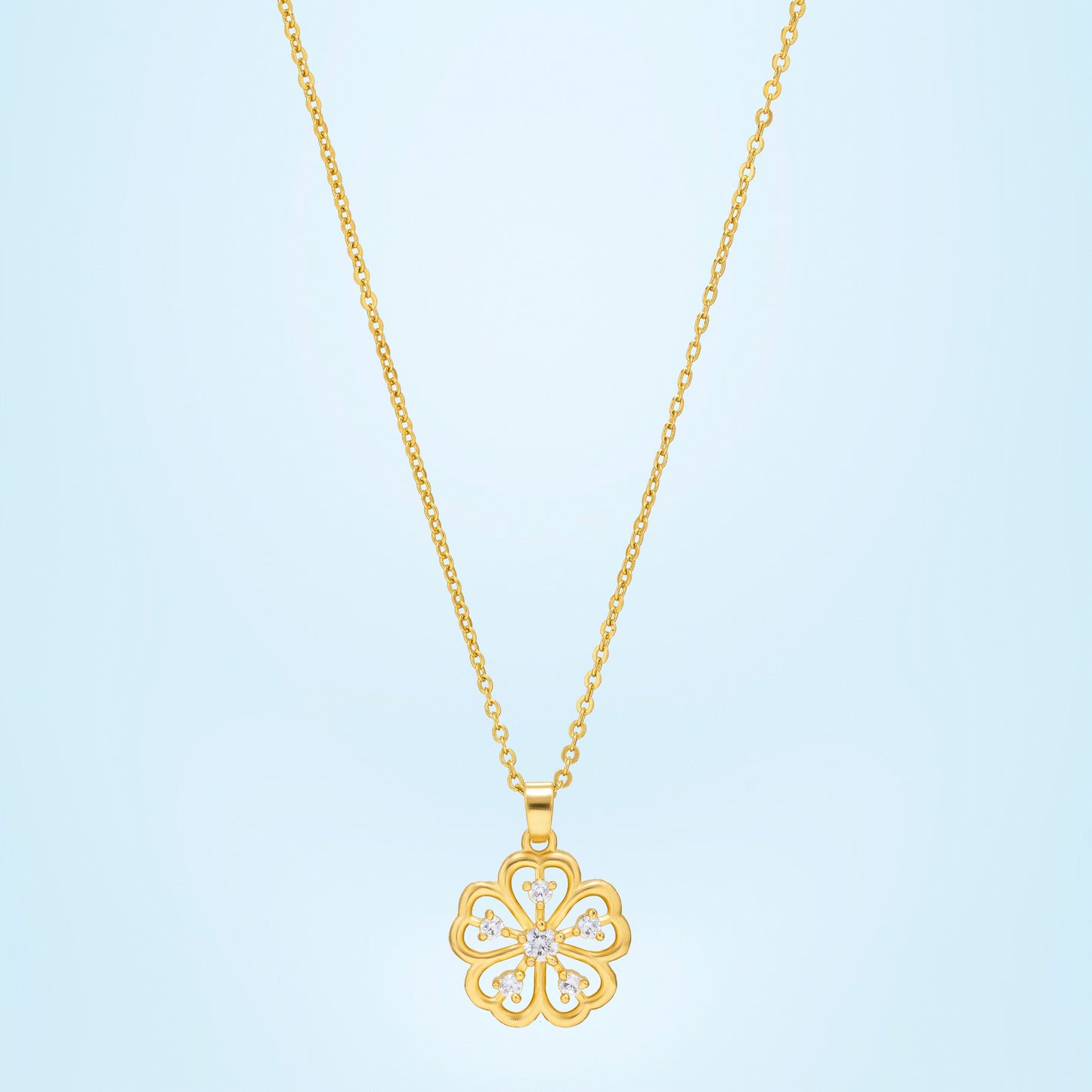 golden necklace with a clover design