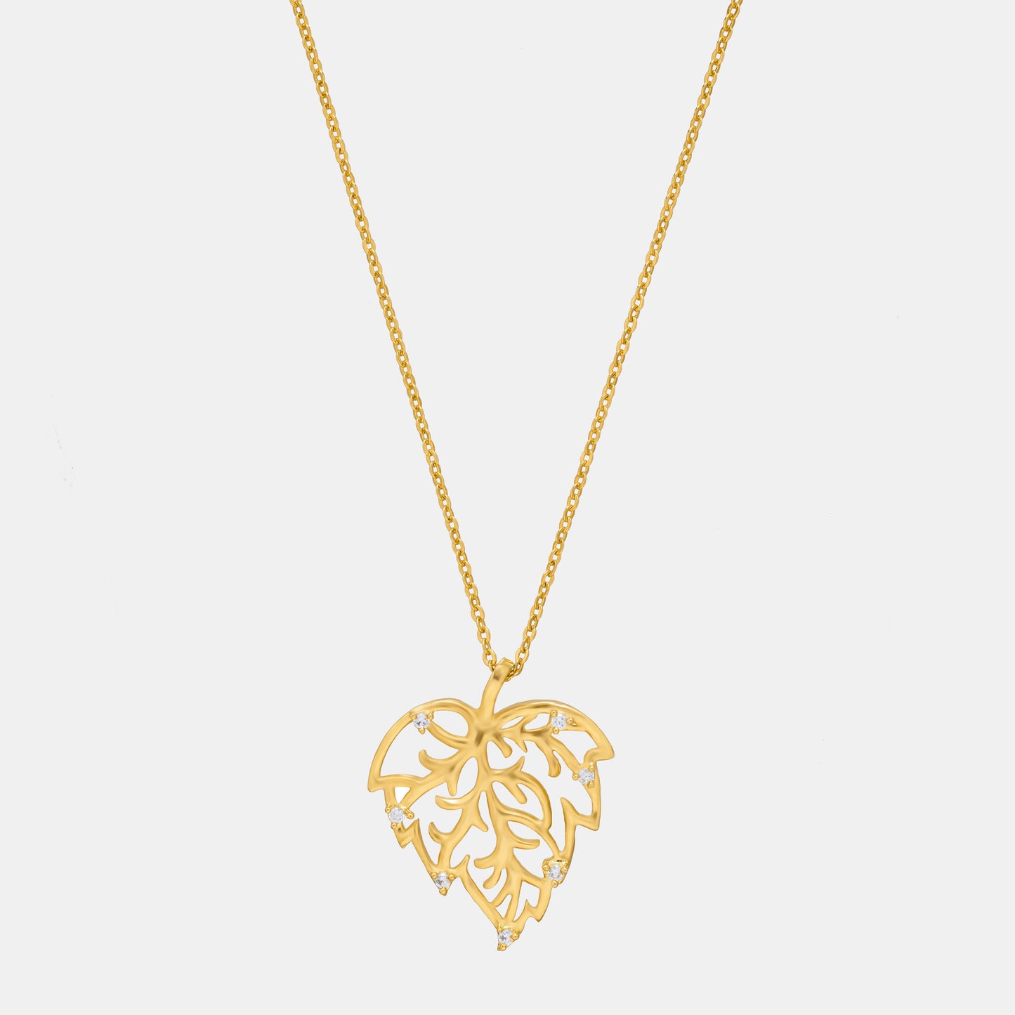 golden necklace with a leaf design on it