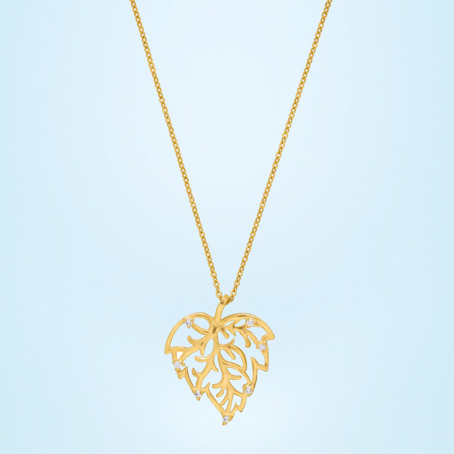 golden necklace with a leaf design on it