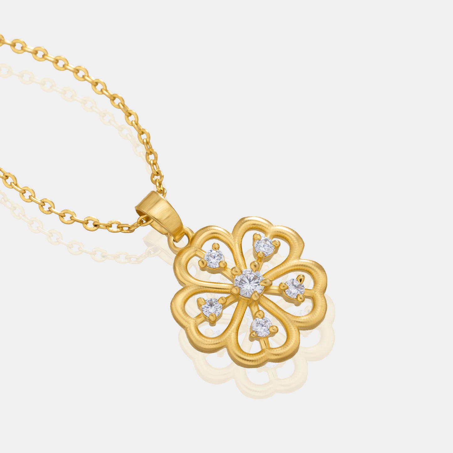 golden necklace with a clover design