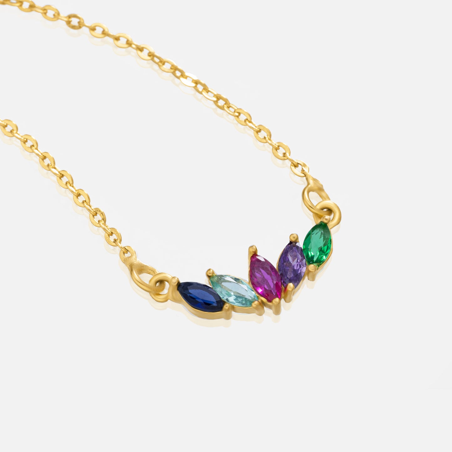 golden necklace with multi colored stone