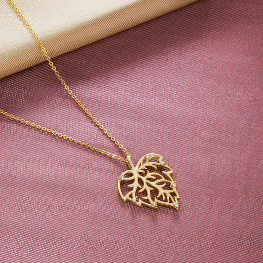 Golden Necklace with a Leaf Design on it