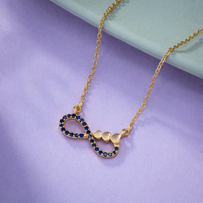 Shine Bright with this Stunning Golden Necklace Featuring a Blue Infinity