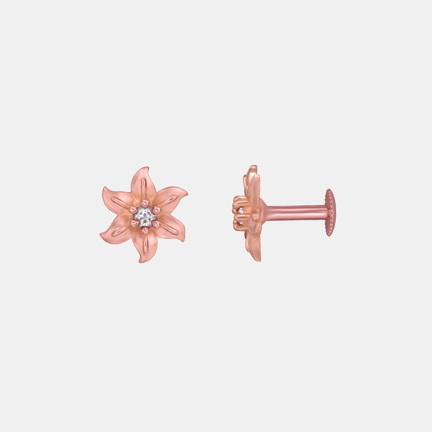 pair of rose gold earrings with white stones