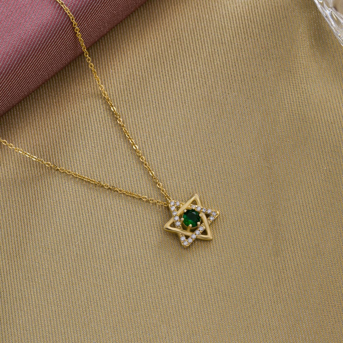 golden necklace with a stone