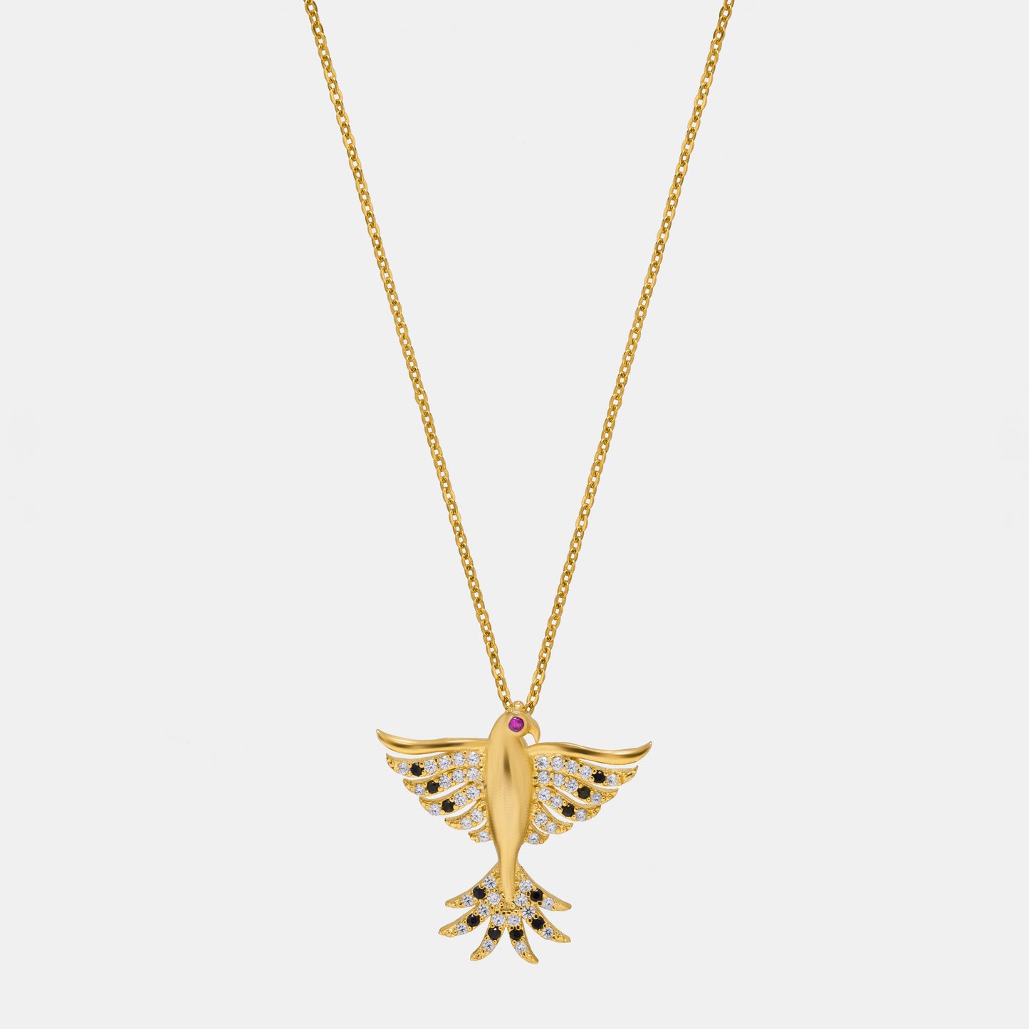 golden necklace with a bird on it