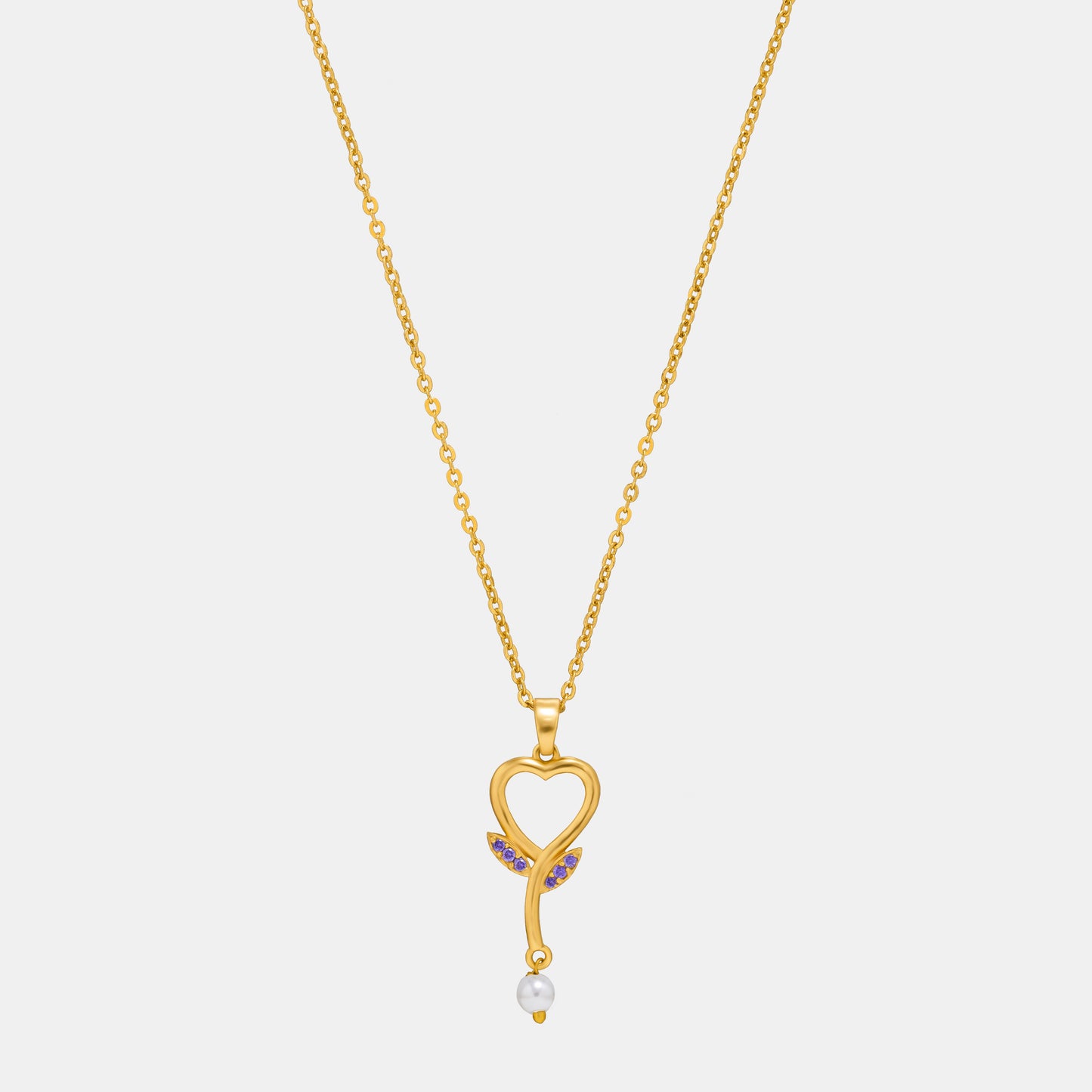 golden necklace with a diamond heart pendant