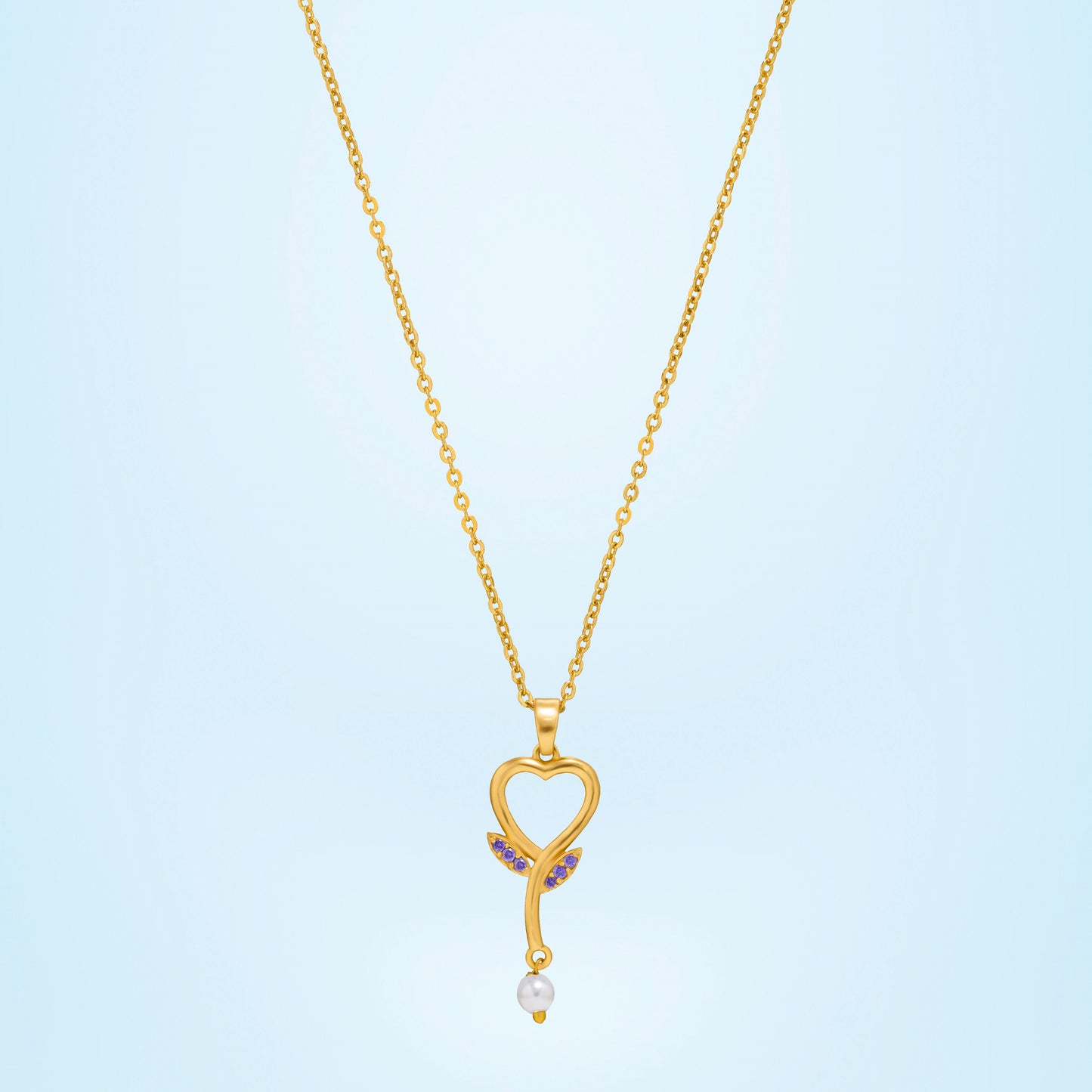 golden necklace with a diamond heart pendant