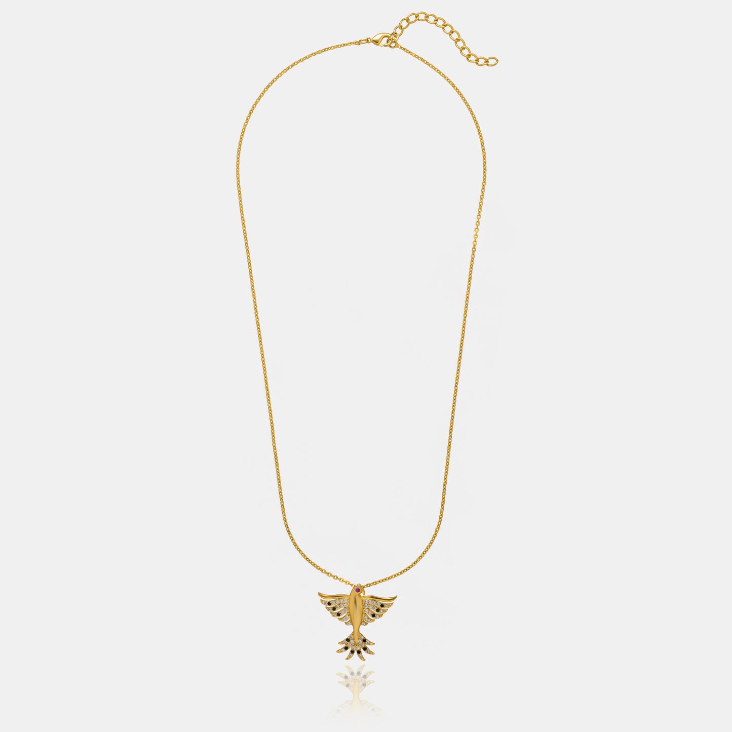 golden necklace with a bird on it