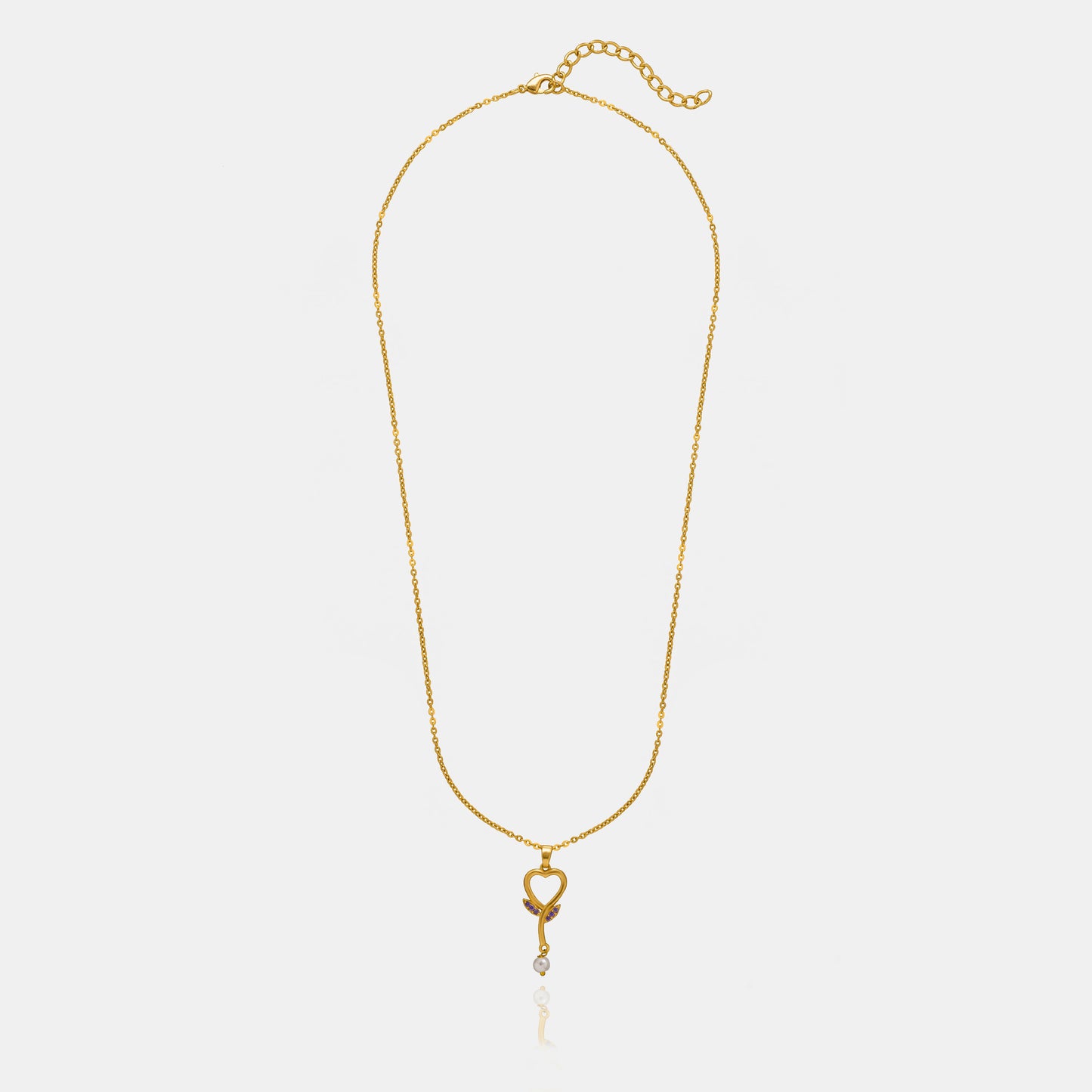 golden necklace with a diamond heart pendant