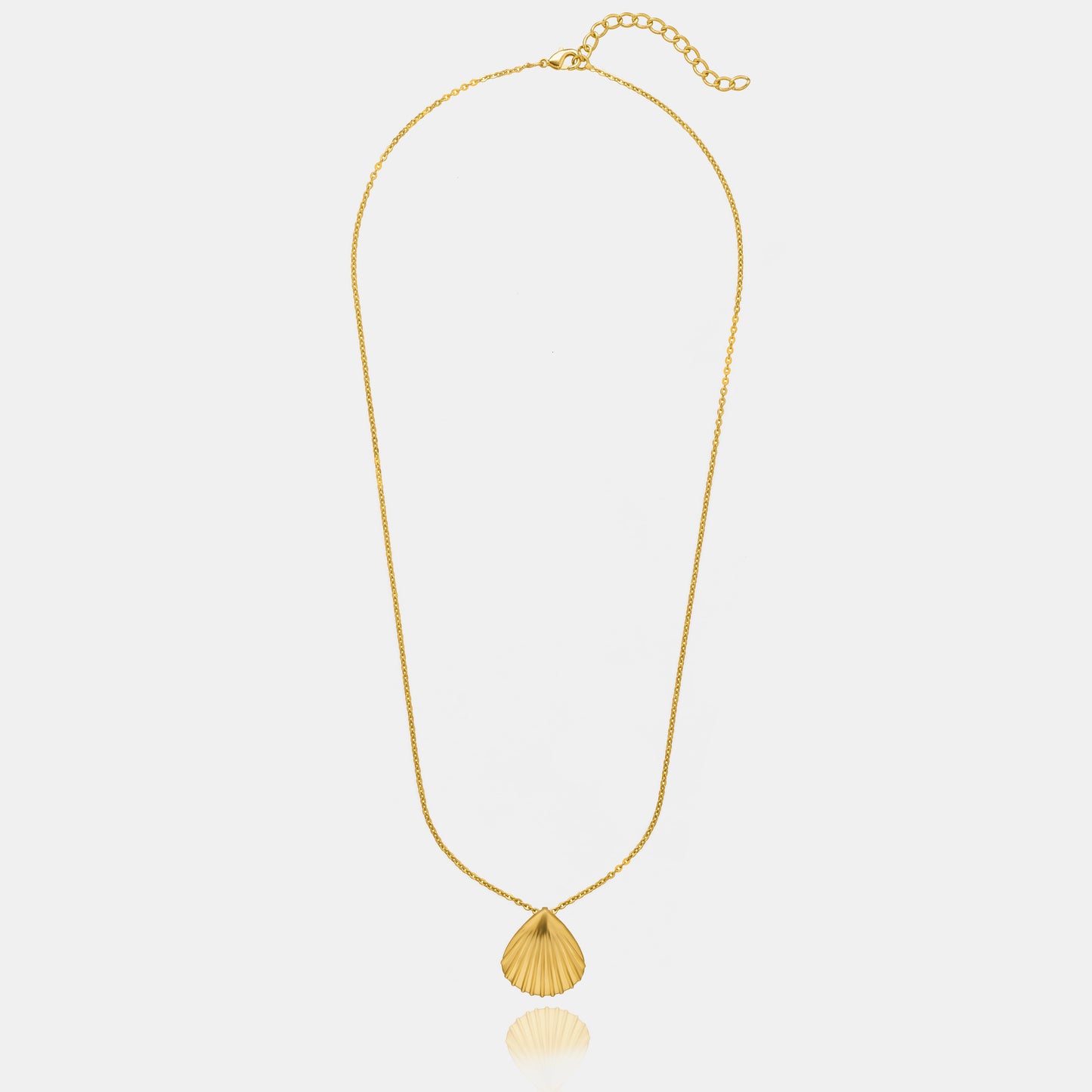 golden necklace with a shell on it