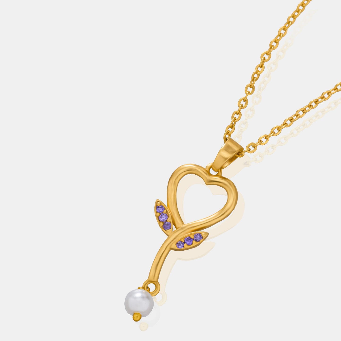 golden necklace with a diamond heart pendant