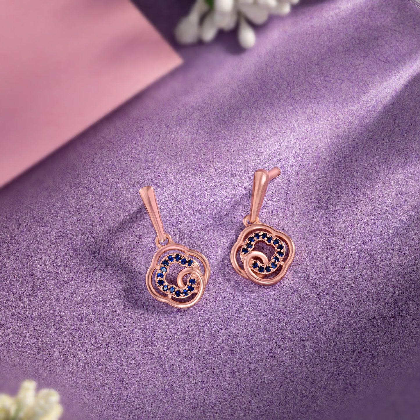 rose gold earrings with blue diamonds