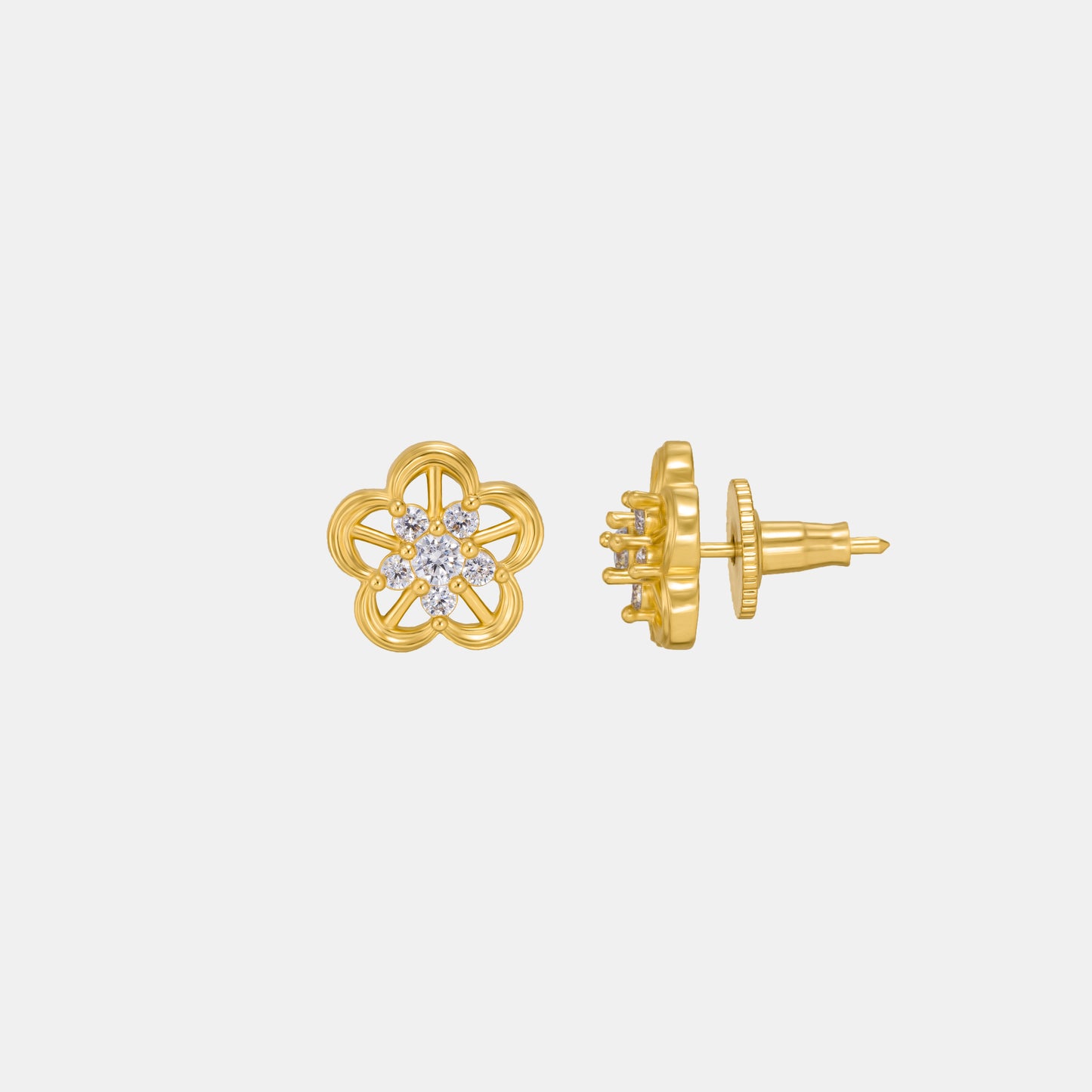 pair of golden earrings with a flower design