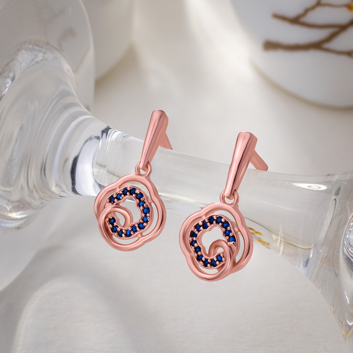 rose gold earrings with blue diamonds