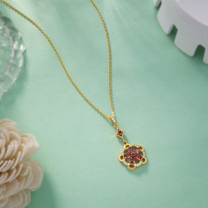 Golden Necklace Adorned with a Striking Red Flower Pendant