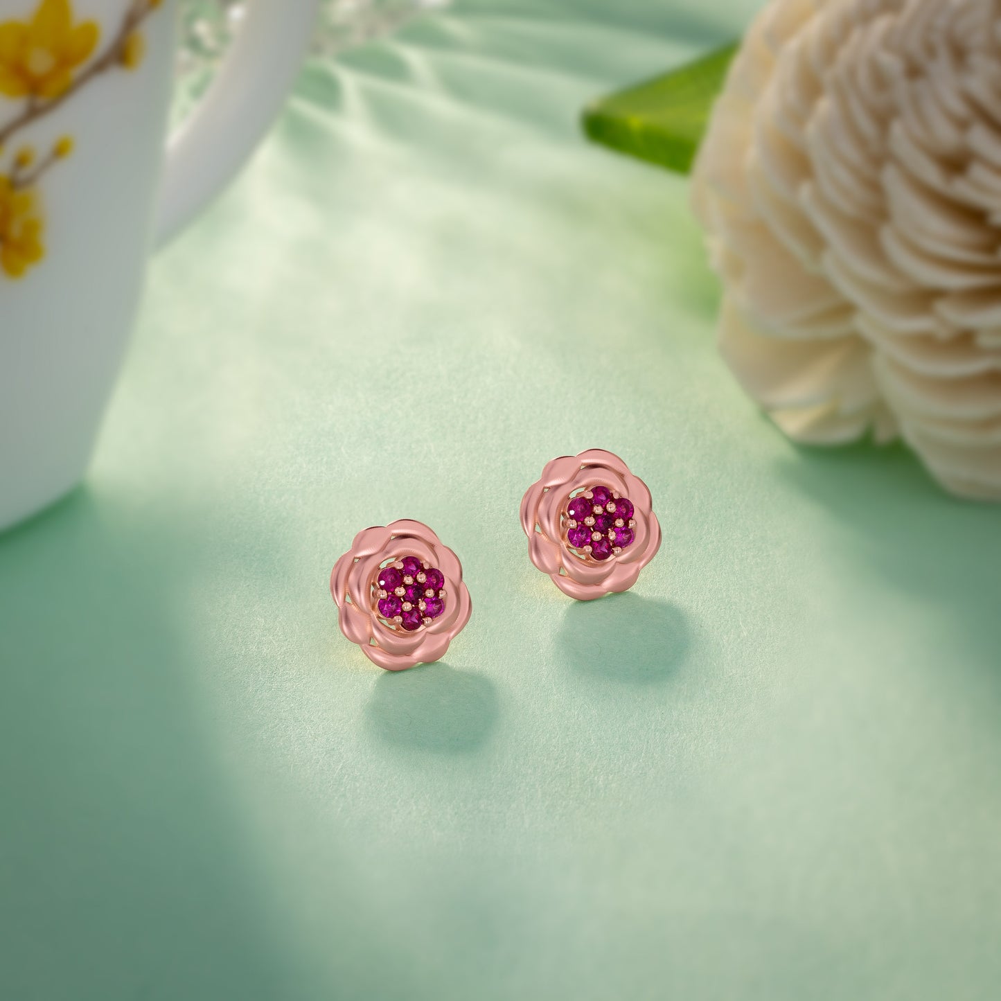 rose gold flower stud earrings with red diamonds