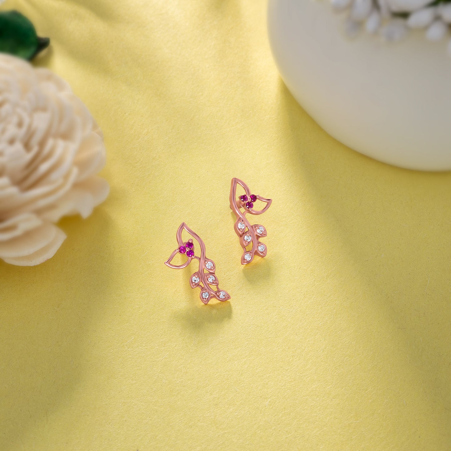 pair of rose gold earrings with diamonds