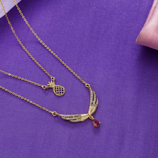 Golden Necklace with a Bird Pendant and a Pink Stone