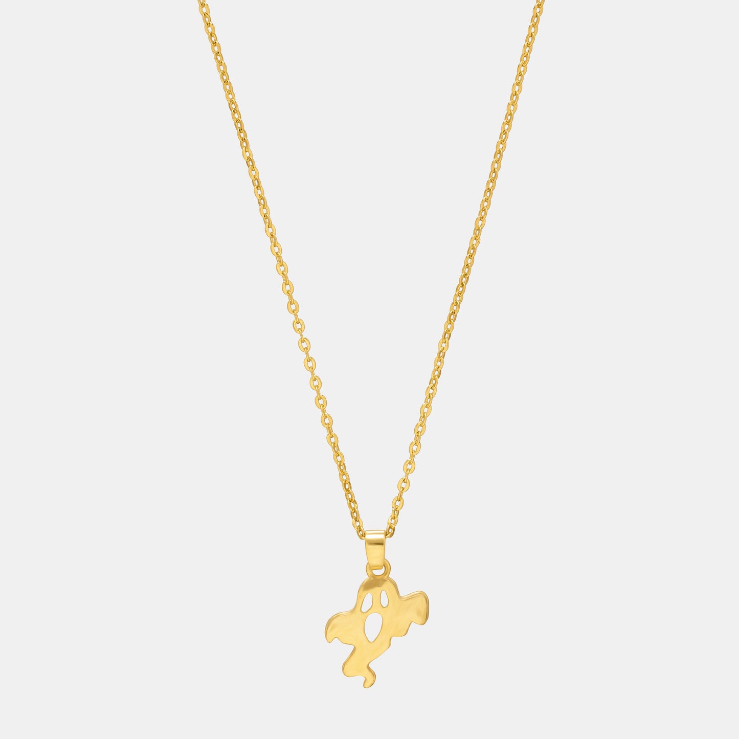 golden necklace with a small ghost  on it