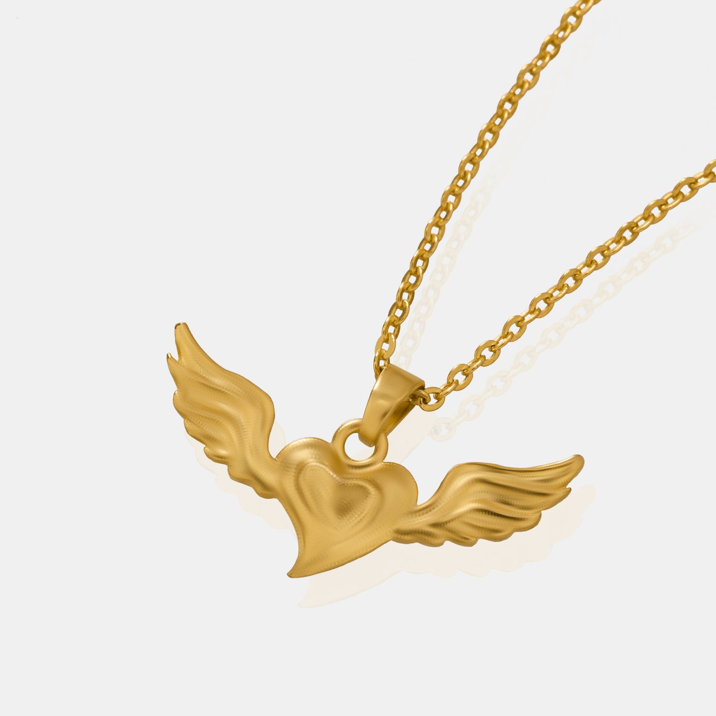 golden necklace with a bird on it