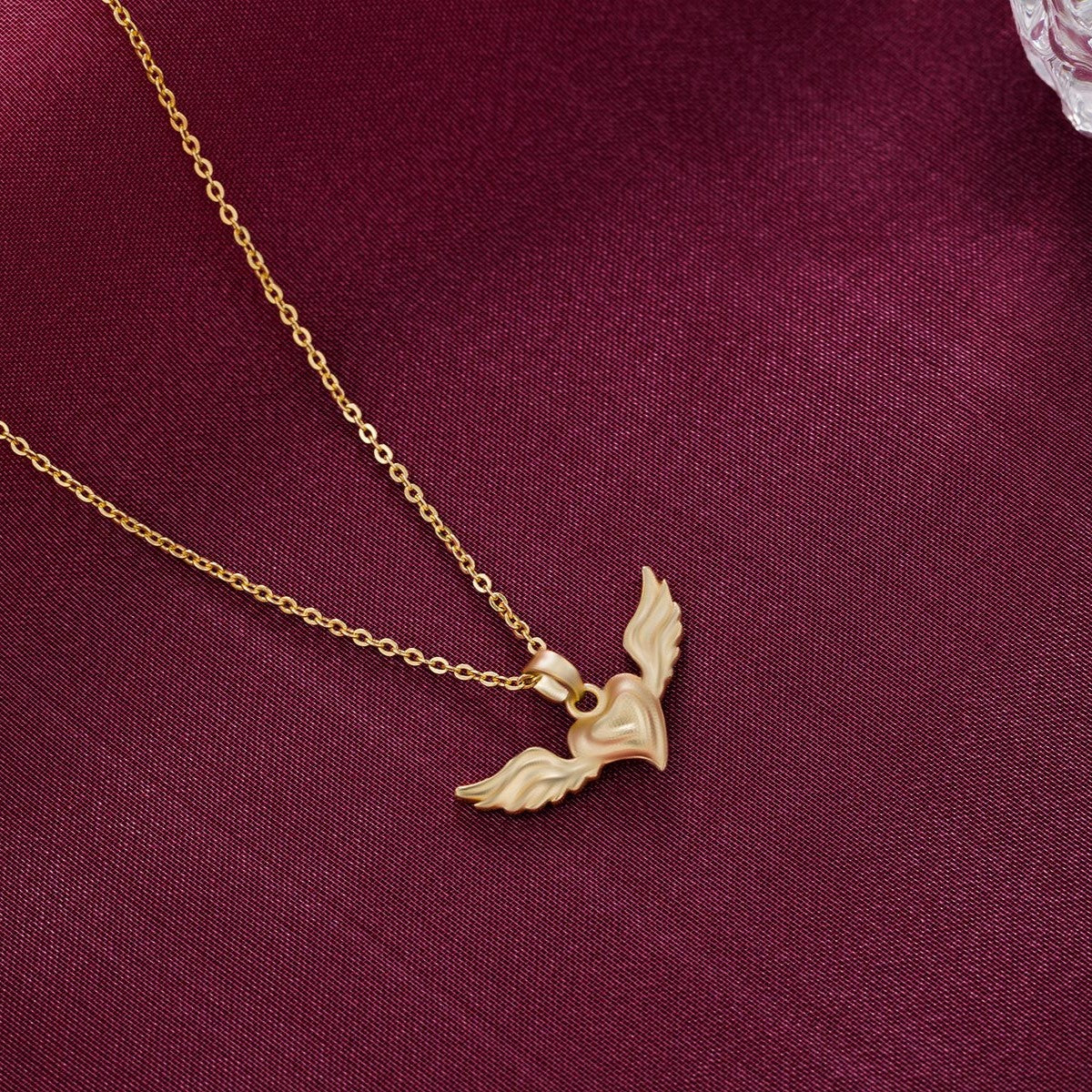 golden necklace with a bird on it