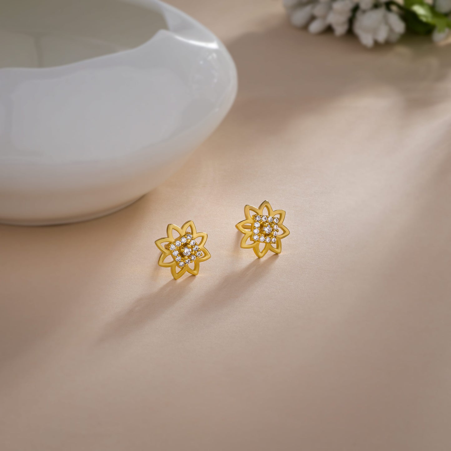 pair of golden earrings with diamonds