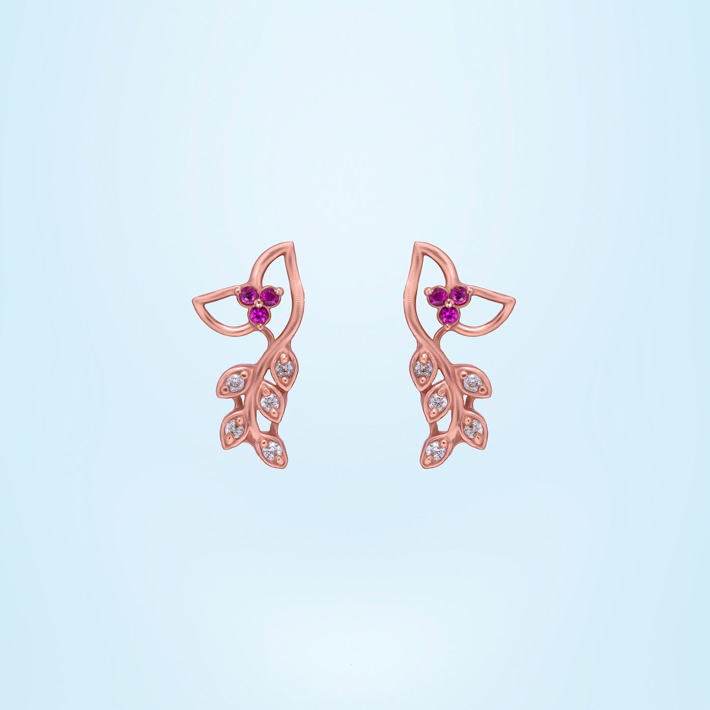 pair of rose gold earrings with diamonds