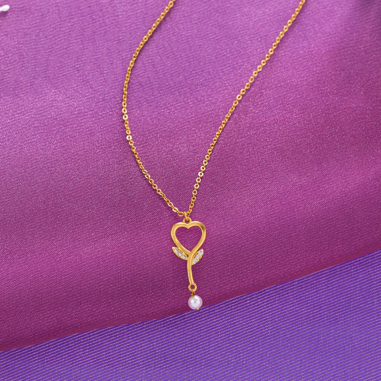 golden necklace with  diamond heart pendant