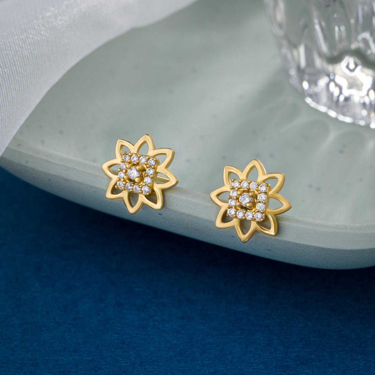 pair of golden earrings with diamonds