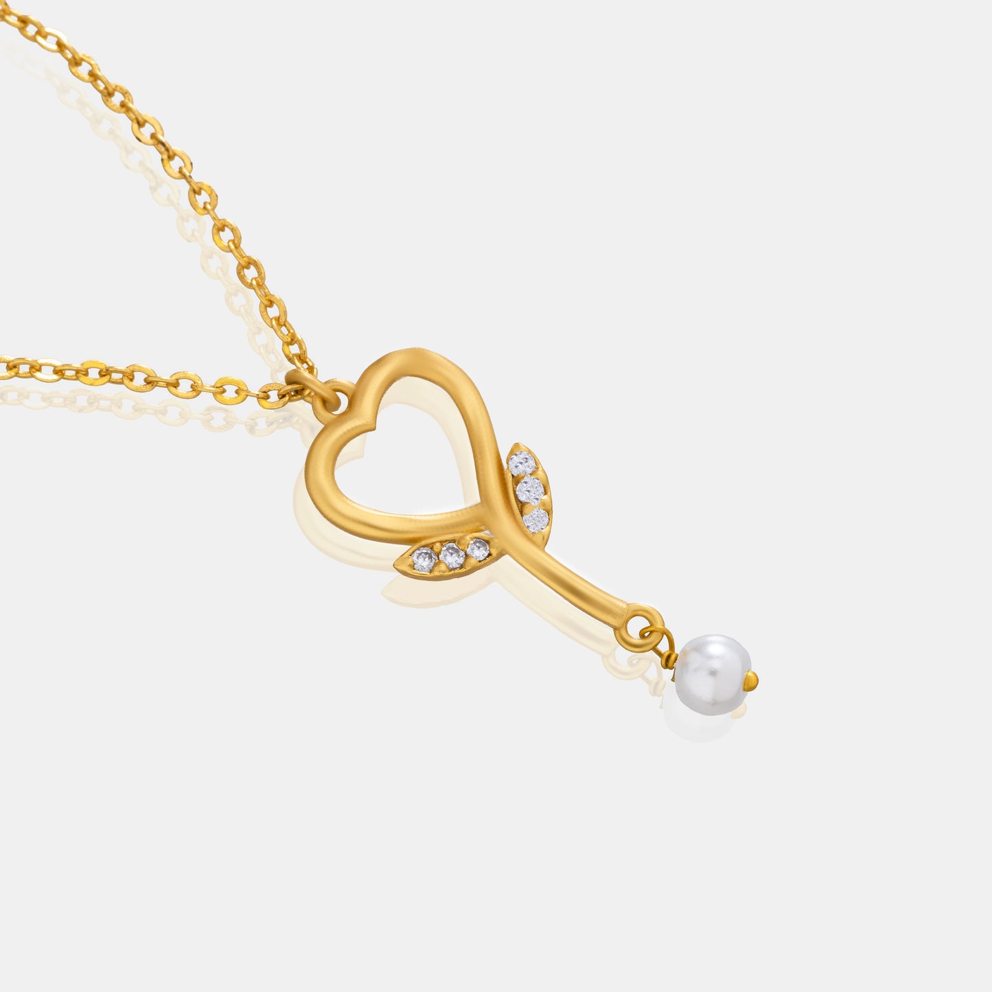 golden necklace with  diamond heart pendant