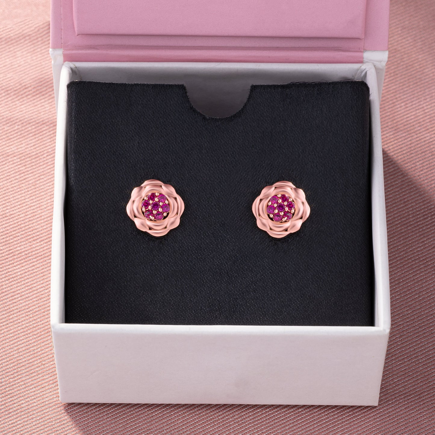 rose gold flower stud earrings with red diamonds