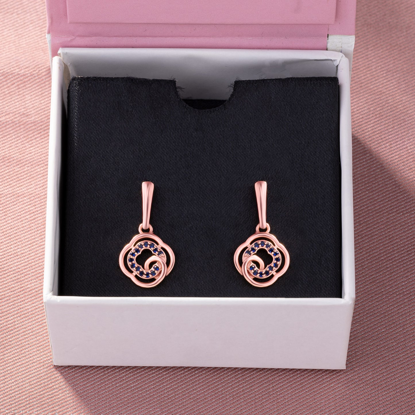 rose gold earrings with blue diamonds