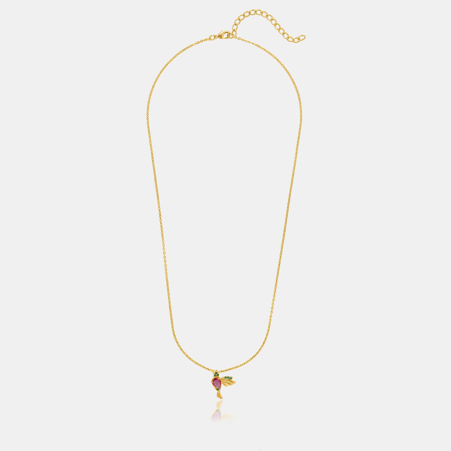 golden necklace with a bird pendant