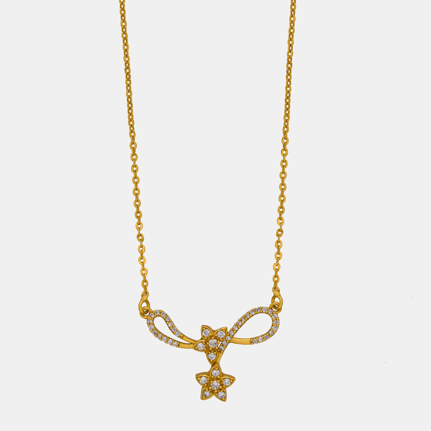 golden necklace with a diamond star on it