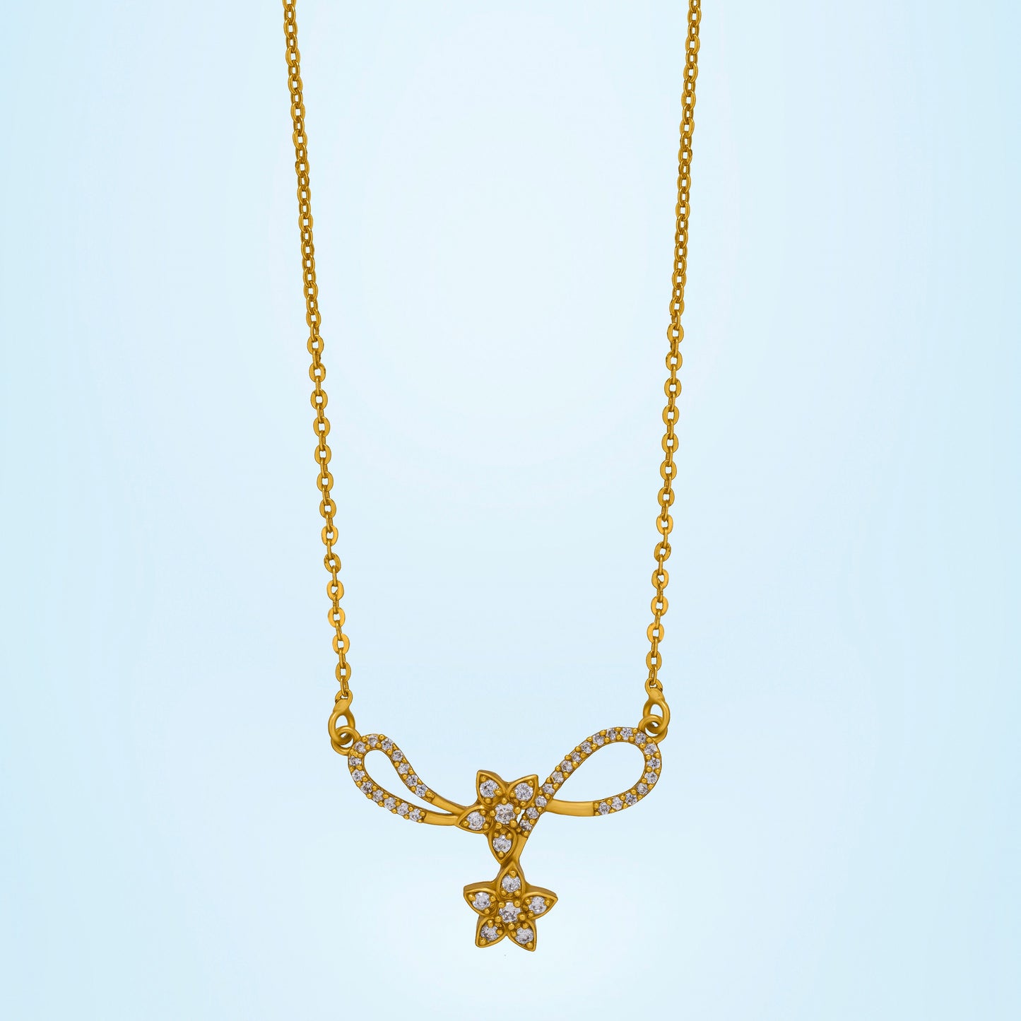 golden necklace with a diamond star on it