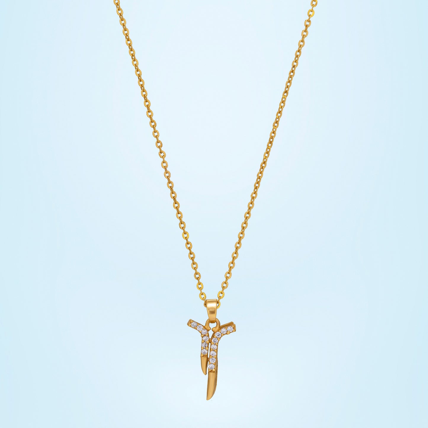 golden necklace with a diamond pendant