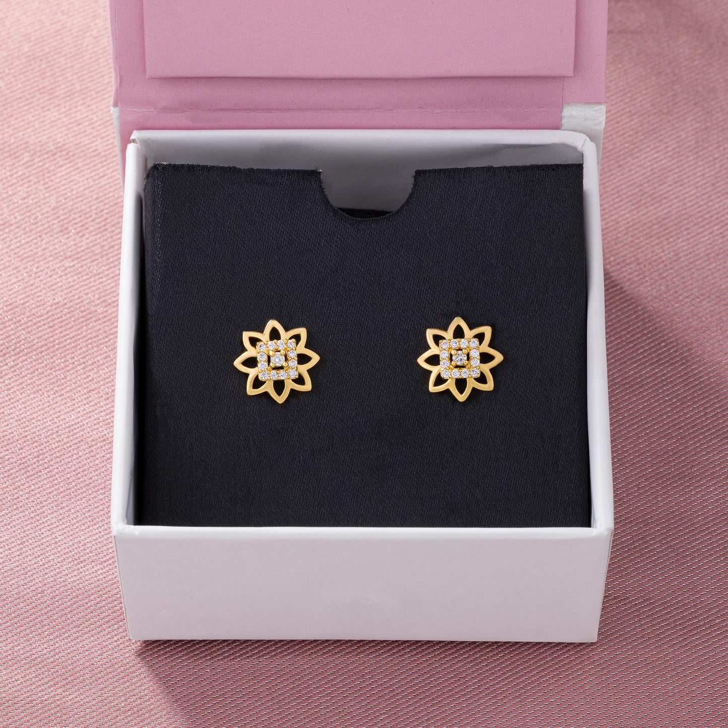 pair of golden earrings with diamonds