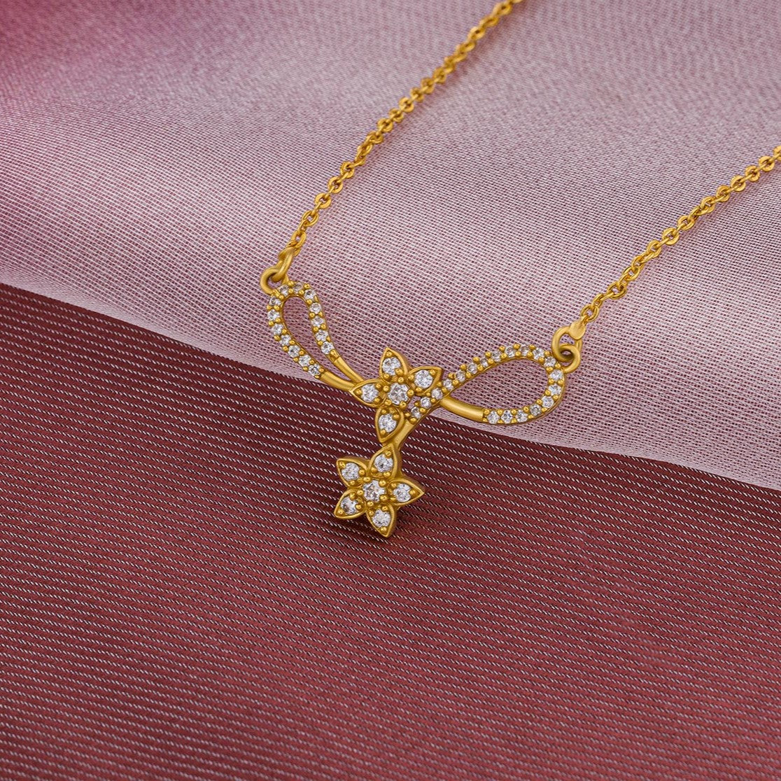 golden necklace with a diamond star on it